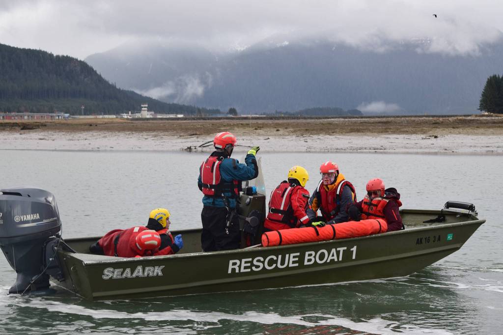A Capital City Fire/Rescue boat takes fictitious plane crash survivors back to an incident command center during a wide-area search exercise as part of the Alaska Shield emergency response program on Friday, April 12, 2019. (Nolin Ainsworth | Juneau Empire)