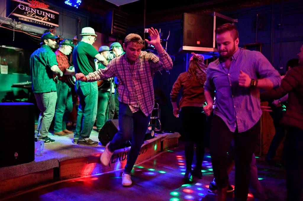 Bar patrons and music lovers dance to Big Chimney Barn Dance at The Rendezvous during Alaska Folk Festival week on Friday, April 12, 2019. (Michael Penn | Juneau Empire)