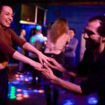 Jenny-Marie Stryker and Eric Oravsky dance to Big Chimney Barn Dance at The Rendezvous during Alaska Folk Festival week on Friday, April 12, 2019. (Michael Penn | Juneau Empire)