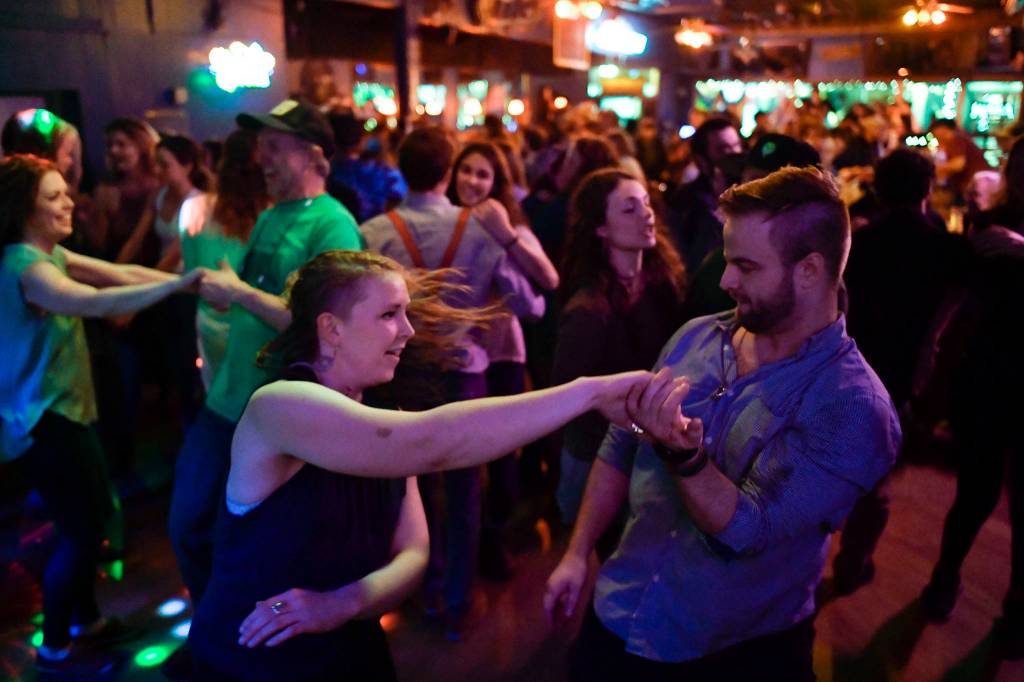 Kelsey Schober and Shea Siagert dance to Big Chimney Barn Dance at The Rendezvous during Alaska Folk Festival week on Friday, April 12, 2019. (Michael Penn | Juneau Empire)