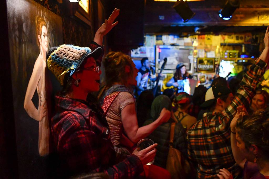 Bar patrons and music lovers catch The Shoot Dangs at the Alaskan Hotel & Bar during Alaska Folk Festival week on Friday, April 12, 2019. (Michael Penn | Juneau Empire)