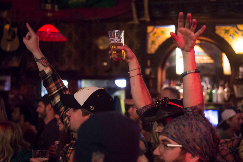 Bar patrons and music lovers catch The Shoot Dangs at the Alaskan Hotel & Bar during Alaska Folk Festival week on Friday, April 12, 2019. (Michael Penn | Juneau Empire)