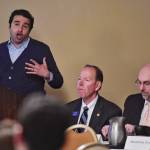 Mouhcine Guettabi, Assistant Professor of Economics for the Institute of Social Economic Research at the University of Alaska, speaks as Joe Schierhorn, President, CEO and COO of Northrim Bank, center, and Mark Edwards, an economist with Northrim Bank, listen during the 2019 Alaska Economic Luncheon sponsored by Northrim Bank at the Baranof Hotel on Monday, April 15, 2019. (Michael Penn | Juneau Empire)