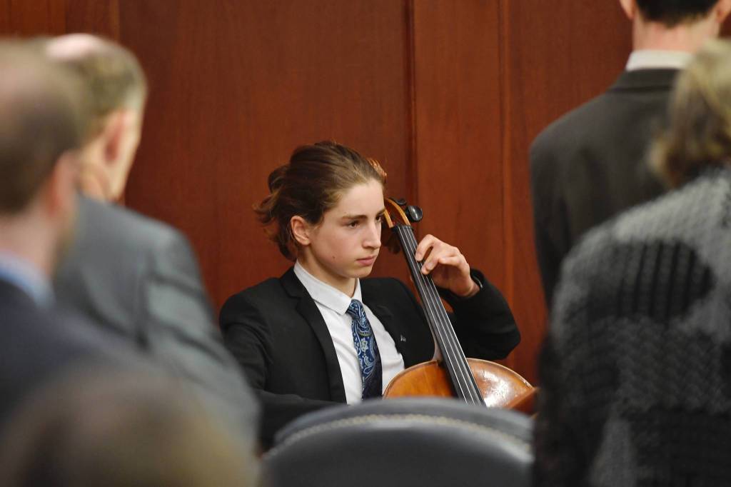Finn Morley, a sophomore at Juneau-Douglas High School, plays the Alaska Flag Song on his cello for the invocation during the opening of the House floor session on Tuesday, April 16, 2019. (Michael Penn | Juneau Empire)
