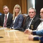 Amanda Price, Commissioner of the Department of Public Safety, center, is surrounded by Department of Public Safety officials during a press conference on her confirmation to the position at the Capitol on Tuesday, April 16, 2019. (Michael Penn | Juneau Empire)