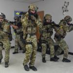 Member of the Juneau Police Department SWAT team enter a room during a joint training exercise with members of Capital City Fire/Rescue at the former Public Safety Building on Whittier Street on Tuesday, April 16, 2019. The training is designed to boost collaboration between CBJ law enforcement and emergency medical personnel. (Michael Penn | Juneau Empire)