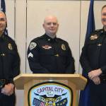 Sgt. Matt Dubois, center, stands with Juneau Police Chief Ed Mercer, left, and Deputy Chief David Campbell, right, during his promotion ceremony on Monday, April 15, 2019. (Courtesy photo | Juneau Police Department Facebook)