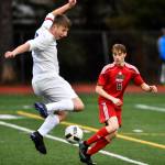 Thunder Mountains Kieran Kollar, left, defends against Juneau-Douglas Koby Goldstein at Adair-Kennedy Memorial Field on Wednesday, April 17, 2019. Thunder Mountain won 2-1. (Michael Penn | Juneau Empire)
