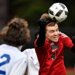 Juneau-Douglas William Hoover heads the ball against Thunder Mountain at Adair-Kennedy Memorial Field on Wednesday, April 17, 2019. Thunder Mountain won 2-1. (Michael Penn | Juneau Empire)