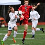 Juneau-Douglas Koby Goldstein, right, kicks the ball away from Thunder Mountains Gavin Gende at Adair-Kennedy Memorial Field on Wednesday, April 17, 2019. Thunder Mountain won 2-1. (Michael Penn | Juneau Empire)