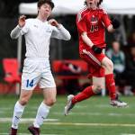 Thunder Mountains Jake Babcock, left, and Juneau-Douglas Kanon Goetz battle to control the ball at Adair-Kennedy Memorial Field on Wednesday, April 17, 2019. Thunder Mountain won 2-1. (Michael Penn | Juneau Empire)