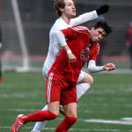 Thunder Mountains Wallace Adams, left, and Juneau-Douglas Kaiden Wilshusen attempt to control the ball at Adair-Kennedy Memorial Field on Wednesday, April 17, 2019. Thunder Mountain won 2-1. (Michael Penn | Juneau Empire)