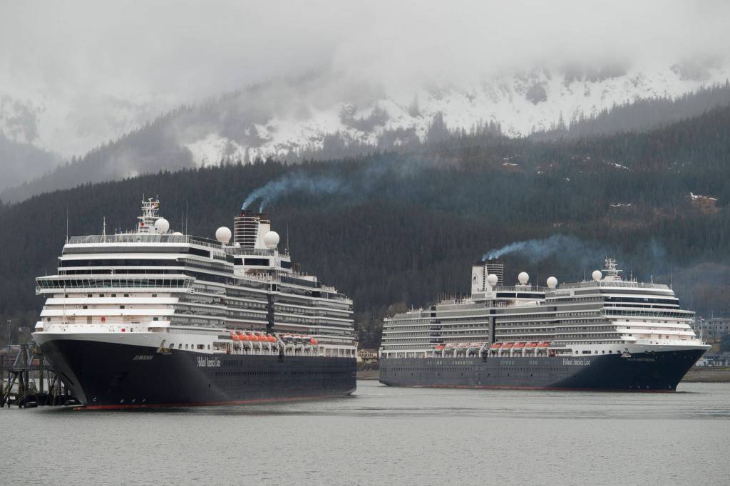 In this May 1, 2017 photo, the Holland America Line cruise ships Eurodam, left, and Nieuw Amsterdam pull into Juneaus downtown harbor. (Michael Penn | Juneau Empire File)