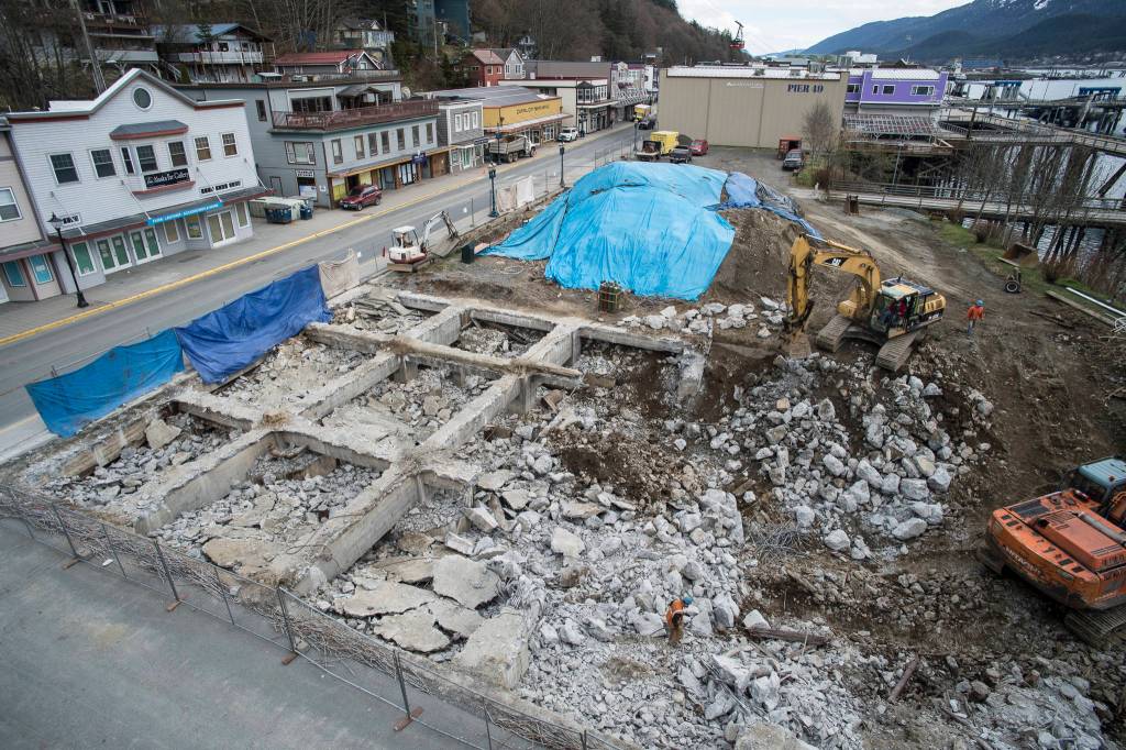 The foundation of the former Juneau Cold Storage is broken down on Monday, April 15, 2019, as work starts on Phase 1 of the Archipelago Lot Project on South Franklin. The phase includes a three-quarter-acre deck over out to the Seawalk to be built this summer at a cost of $19 million, with funding coming from the Dock Fund, Port Development Fees, Commercial Passenger Vessel Excise Tax, and Marine Passenger Fees. (Michael Penn | Juneau Empire)