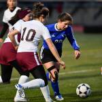 Thunder Mountains Riley Traxler is surrounded by Ketchikans Jaat Haana Timmerman, left, Collette Rhein, center, and Kaelyn Cadiente at TMHS on Friday, April 19, 2019. Thunder Mountain won 3-1. (Michael Penn | Juneau Empire)