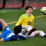 Ketchikans goal keeper Sullivan Schultz stops a point-blank shot by Thunder Mountains Phillip Lam at TMHS on Friday, April 19, 2019. Thunder Mountain won 2-1. (Michael Penn | Juneau Empire)