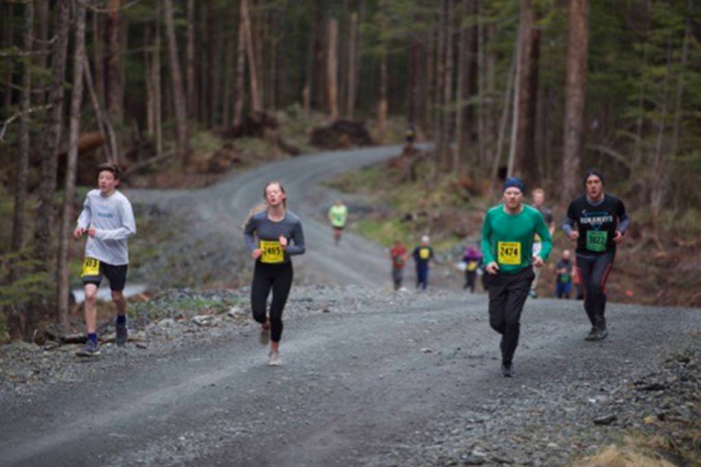 Runners race in the Run 4 the Rock race on Pioneer Road and North Douglas Highway on Saturday. (Courtesy photo | Matthew York)