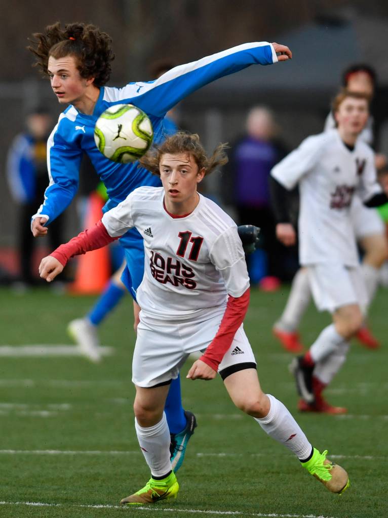 Juneau-Douglas Jackson Norberg, right, and Thunder Mountains Crispin Campbell vie for the ball during their game at TMHS on Tuesday, April 23, 2019. JDHS won 2-0. (Michael Penn | Juneau Empire)