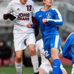 Juneau-Douglas Ronan Davies, left, takes a header against Thunder Mountains Wallace Adams during their game at TMHS on Tuesday, April 23, 2019. JDHS won 2-0. (Michael Penn | Juneau Empire)
