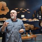 Dean Graber, owner of Rainforest Custom, talks Thursday, April 25, 2019, about his new shop on South Franklin Street that will display his and 14 other local artisans handicrafts. (Michael Penn | Juneau Empire)