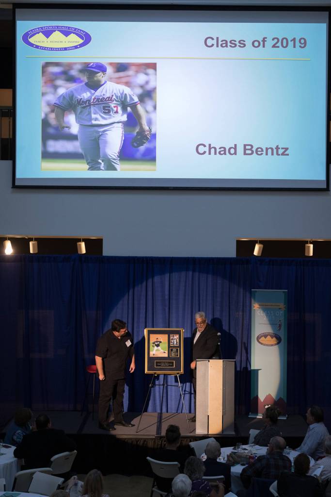 Chad Bentz is presented a plaque at the 13th annual Alaska Sports Hall of Fame Ceremony at the Anchorage Museum Atrium on Thursday, April 25, 2019. (Courtesy Photo | Jim Kohl Photography)
