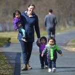 Shannon Fisher, executive director of Family Promise of Juneau, watches over the children of Steve and Mary Littlefield, Angeline, Maximus and Tiana, as the parents are interviewed about the program at Twin Lakes on Wednesday, April 24, 2019. (Michael Penn | Juneau Empire)