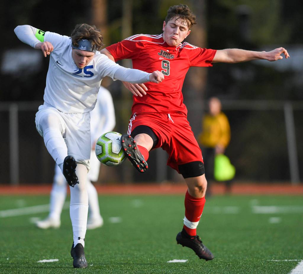 Juneau-Douglas Richard Lehner, right, battles against Soldotnas Cameron Johnson at Adair-Kennedy Memorial Field on Friday, April 26, 2019. JDHS won 6-0. (Michael Penn | Juneau Empire)