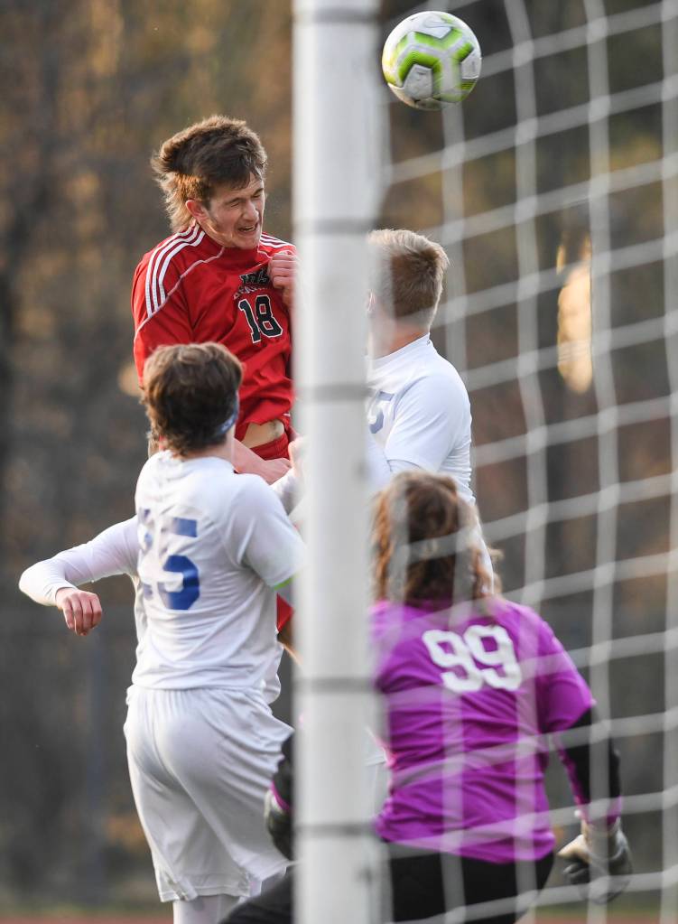 Juneau-Douglas Clem Taylor-Roth attempts to score on Soldotna with a header at Adair-Kennedy Memorial Field on Friday, April 26, 2019. JDHS won 6-0. (Michael Penn | Juneau Empire)