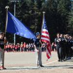 Jake and John Polasky present the colors during the Gastineau Channel Little League Opening Day Ceremonies at Adair-Kennedy Memorial Park on Saturday, April 27, 2019. (Michael Penn | Juneau Empire)