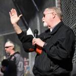 Deacon Charles Rohrbacher, of the Diocese of Juneau, sends out a blessing during the Gastineau Channel Little League Opening Day Ceremonies at Adair-Kennedy Memorial Park on Saturday, April 27, 2019. (Michael Penn | Juneau Empire)