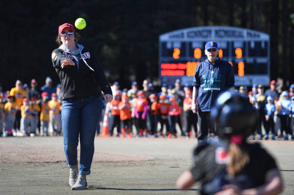 Makayla Harp throws out the first softball pitch to catcher Lily Hayes during the Gastineau Channel Little League Opening Day Ceremonies at Adair-Kennedy Memorial Park on Saturday, April 27, 2019. (Michael Penn | Juneau Empire)