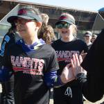 Players run a gauntlet of Thunder Mountain High School baseball and softball team players during the Gastineau Channel Little League Opening Day Ceremonies at Adair-Kennedy Memorial Park on Saturday, April 27, 2019. (Michael Penn | Juneau Empire)