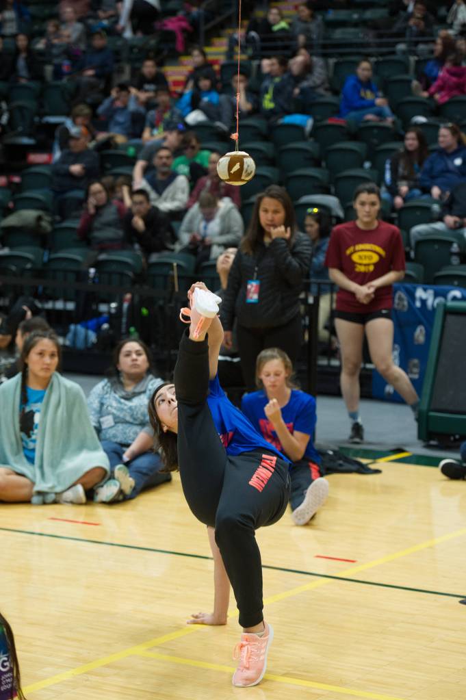 Sara Steeves performs the Alaskan high kick at the 2019 NYO Games at the Alaska Airlines Center in Anchorage, Alaska, on Thursday, April 25, 2019. (Michael Dinneen | For the Juneau Empire)
