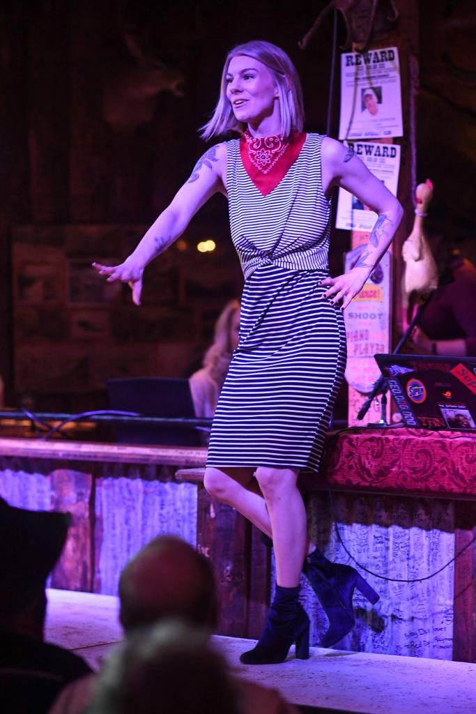 Womens clothing from The Studio is modeled on stage during the Juneau Rotaracts Wild West Roundup Fashion Show at the Red Dog Saloon on Saturday, April 27, 2019. (Michael Penn | Juneau Empire)