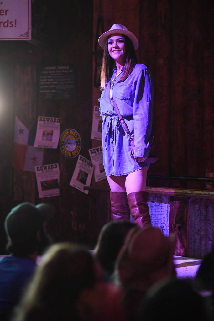 Womens clothing from Alaskan Dames is modeled on stage during the Juneau Rotaracts Wild West Roundup Fashion Show at the Red Dog Saloon on Saturday, April 27, 2019. (Michael Penn | Juneau Empire)