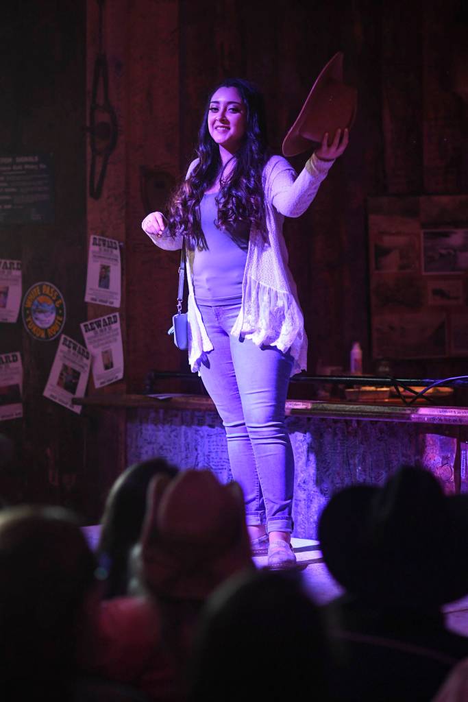Womens clothing from Alaskan Dames is modeled on stage during the Juneau Rotaracts Wild West Roundup Fashion Show at the Red Dog Saloon on Saturday, April 27, 2019. (Michael Penn | Juneau Empire)