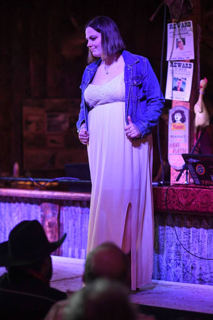 Womens clothing from Alaskan Dames is modeled on stage during the Juneau Rotaracts Wild West Roundup Fashion Show at the Red Dog Saloon on Saturday, April 27, 2019. (Michael Penn | Juneau Empire)