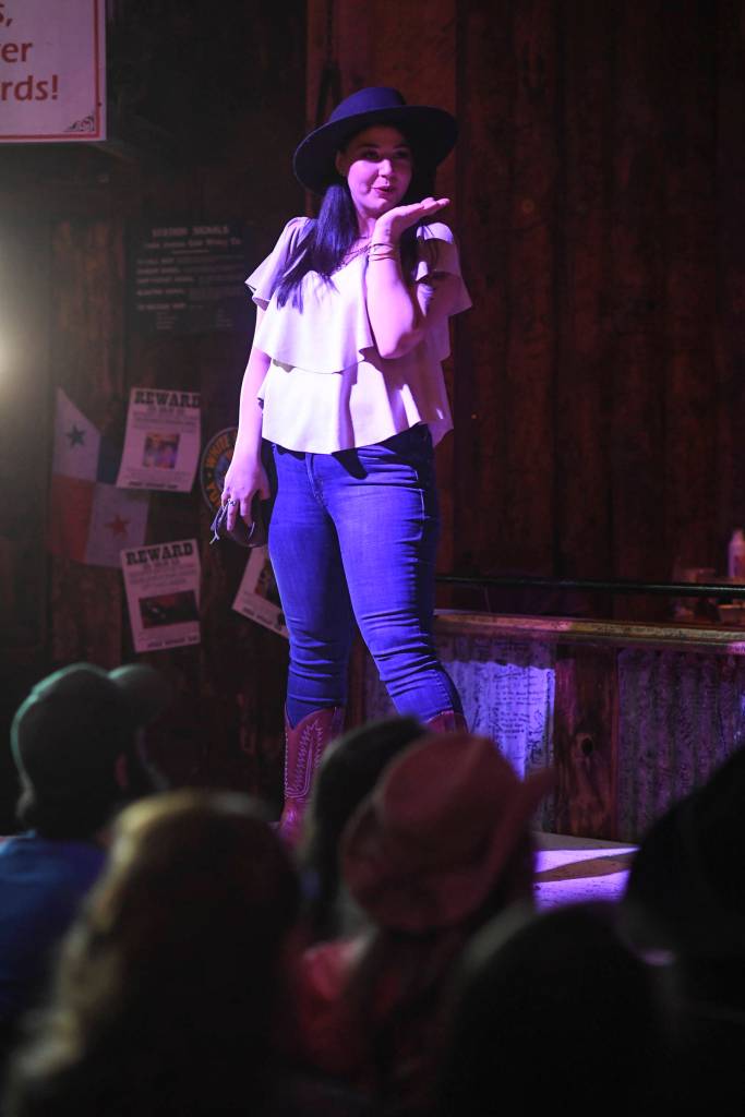 Womens clothing from Alaskan Dames is modeled on stage during the Juneau Rotaracts Wild West Roundup Fashion Show at the Red Dog Saloon on Saturday, April 27, 2019. (Michael Penn | Juneau Empire)