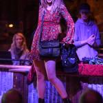 Womens clothing from Alaskan Dames is modeled on stage during the Juneau Rotaracts Wild West Roundup Fashion Show at the Red Dog Saloon on Saturday, April 27, 2019. (Michael Penn | Juneau Empire)