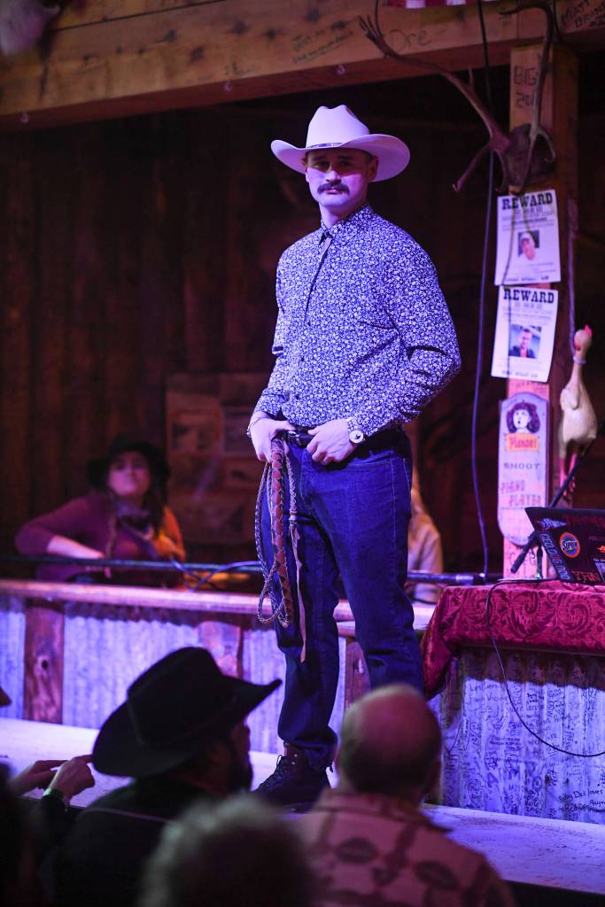Mens clothing from 4th Coast Outfitters is modeled on stage during the Juneau Rotaracts Wild West Roundup Fashion Show at the Red Dog Saloon on Saturday, April 27, 2019. (Michael Penn | Juneau Empire)