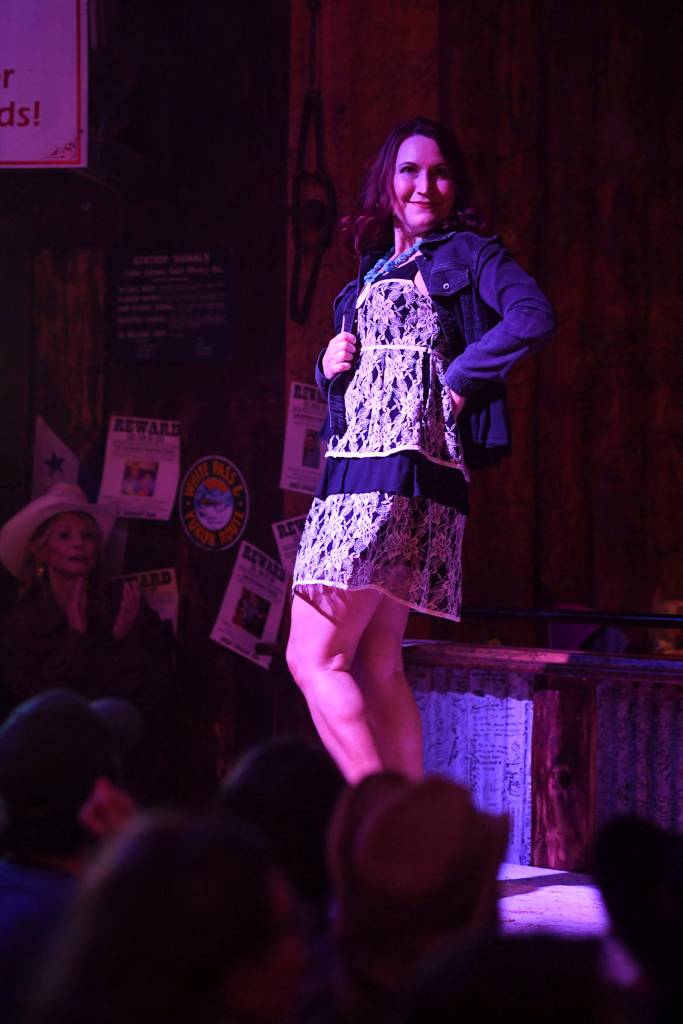 Mens and womens clothing from Downtown Dames Resale Shop is modeled on stage during the Juneau Rotaracts Wild West Roundup Fashion Show at the Red Dog Saloon on Saturday, April 27, 2019. (Michael Penn | Juneau Empire)