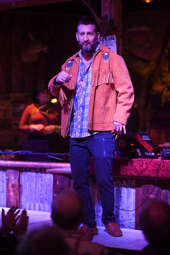 Mens and womens clothing from Downtown Dames Resale Shop is modeled on stage during the Juneau Rotaracts Wild West Roundup Fashion Show at the Red Dog Saloon on Saturday, April 27, 2019. (Michael Penn | Juneau Empire)
