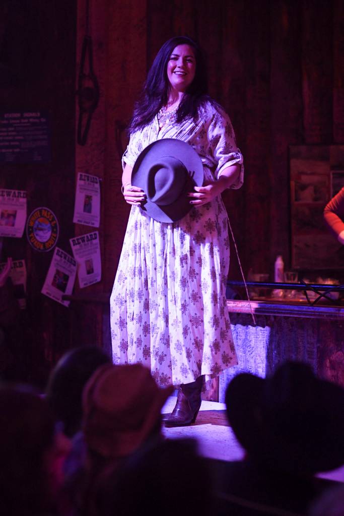 Mens and womens clothing from Downtown Dames Resale Shop is modeled on stage during the Juneau Rotaracts Wild West Roundup Fashion Show at the Red Dog Saloon on Saturday, April 27, 2019. (Michael Penn | Juneau Empire)