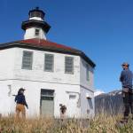Eldred Rock Lighthouse Preservation Association Executive Director Sue York speaks to Marine Exchange of Alaska Field Operations Supervisor Nick Hatch at Eldred Rock Lighthouse on Monday, April 29, 2019. (Alex McCarthy | Juneau Empire)