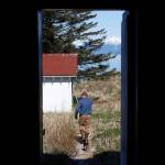 Jonathan Wood, the Marine Exchange of Alaskas representative on the Eldred Rock Lighthouse Preservation Association, walks out of Eldred Rock Lighthouse on Monday, April 29, 2019. (Alex McCarthy | Juneau Empire)