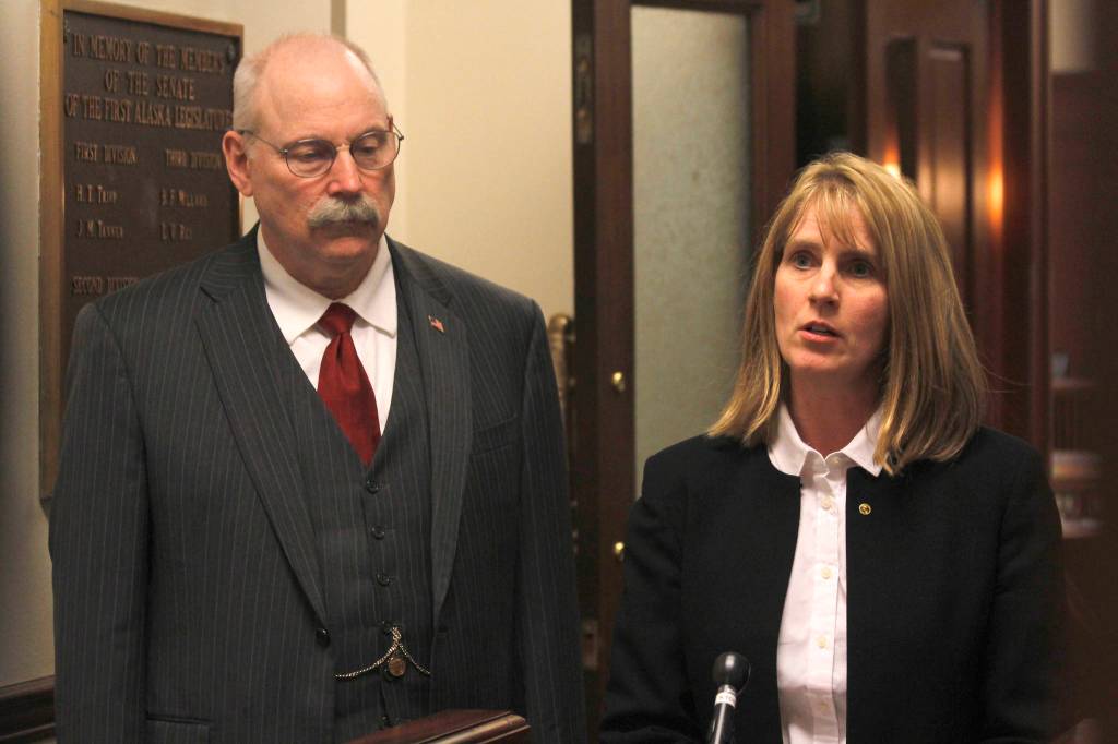 Sen. Natasha von Imhof, R-Anchorage, right, speaks to reporters while Sen. Bert Stedman, R-Sitka, stands by outside the Senate chambers on Wednesday, May 1, 2019. The two are the co-chairs of the Senate Finance Committee. (Alex McCarthy | Juneau Empire)