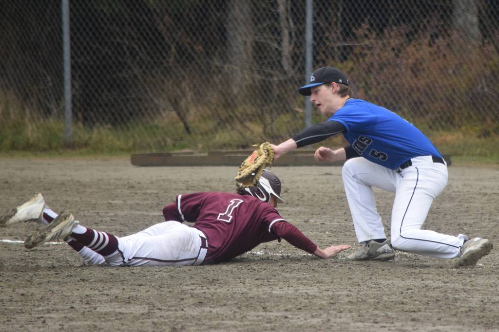Thunder Mountain High School senior Logan Lesmann tags Ketchikans Gavin Salavar in the top of the seventh inning of a Southeast Conference baseball game on Friday, May 3, 2019. (Nolin Ainsworth | Juneau Empire)
