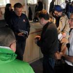 Capt. Michael Schlechter, right, speaks with members of the public on the ferry Tazlina on Sunday, May 5, 2019. (Alex McCarthy | Juneau Empire)