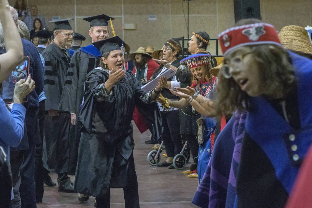 University of Alaska Southeasts commencement address speaker Valerie Nurraraaluk Davidson enters the ceremony to Mt. Juneau Tlingit and Woosh.ji.een dancers on Sunday, May 5, 2019. (Erin Laughlin | For the Juneau Empire)