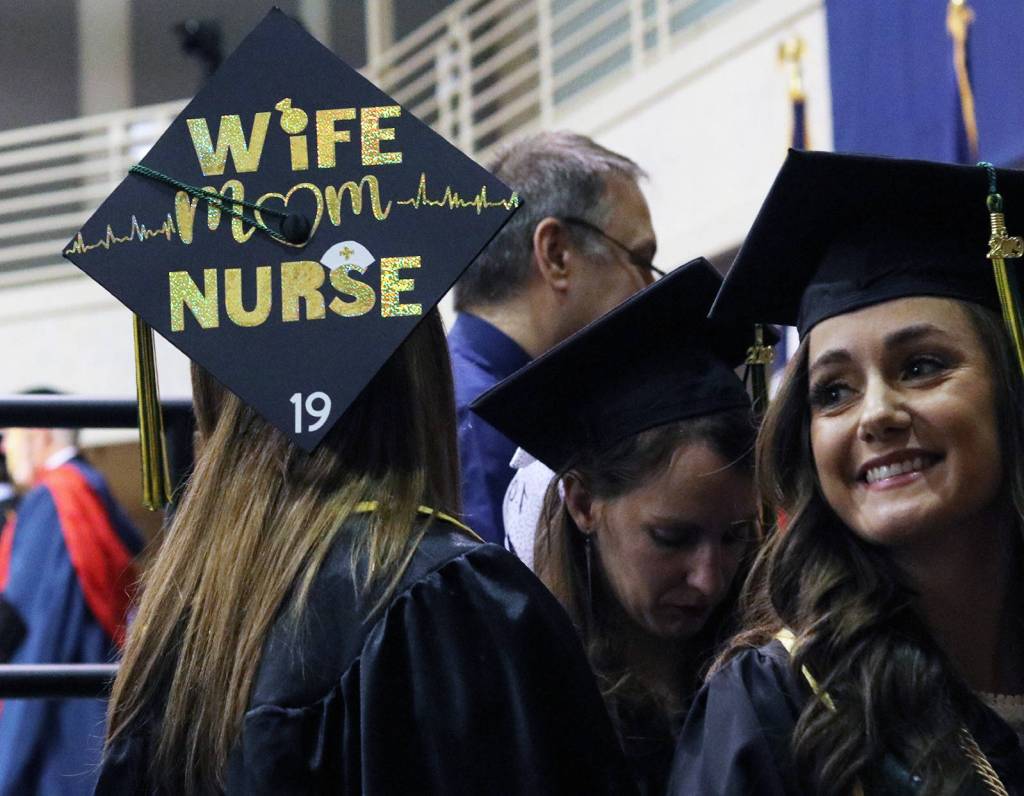 A graduates hat reads Wife mom nurse on Sunday during the University of Alaska Southeast commencement ceremony.